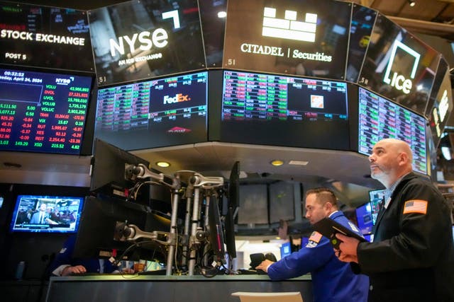 <p>Traders work on the floor of the New York Stock Exchange</p>