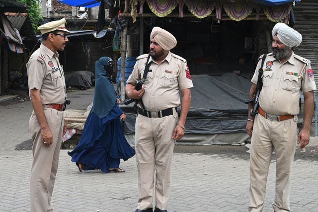 <p>File. Police officers stand guard along a road on the outskirts of Kolkata on 12 July 2023</p>