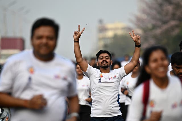 <p>Participants walk down a road during a ‘Vote-A-Thon’ to encourage turnout </p>