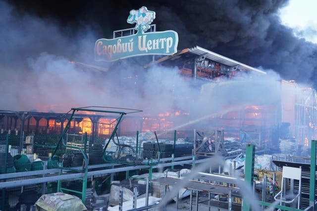 <p>Firefighters extinguish the blaze at a shopping centre in Kharkiv  </p>
